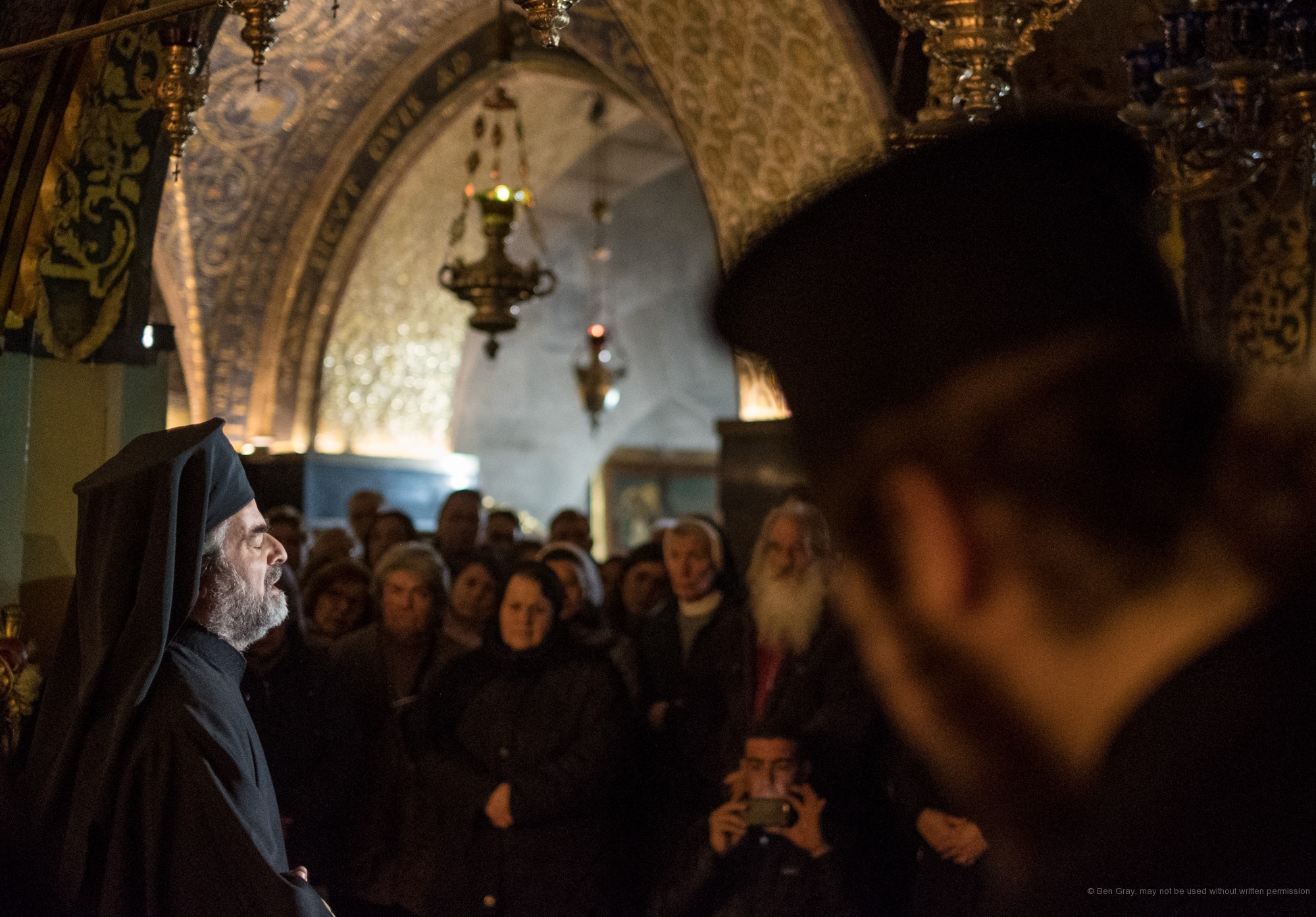A Greek Orthodox priest leads a worship service for the World Week of prayer for Christian Unity.