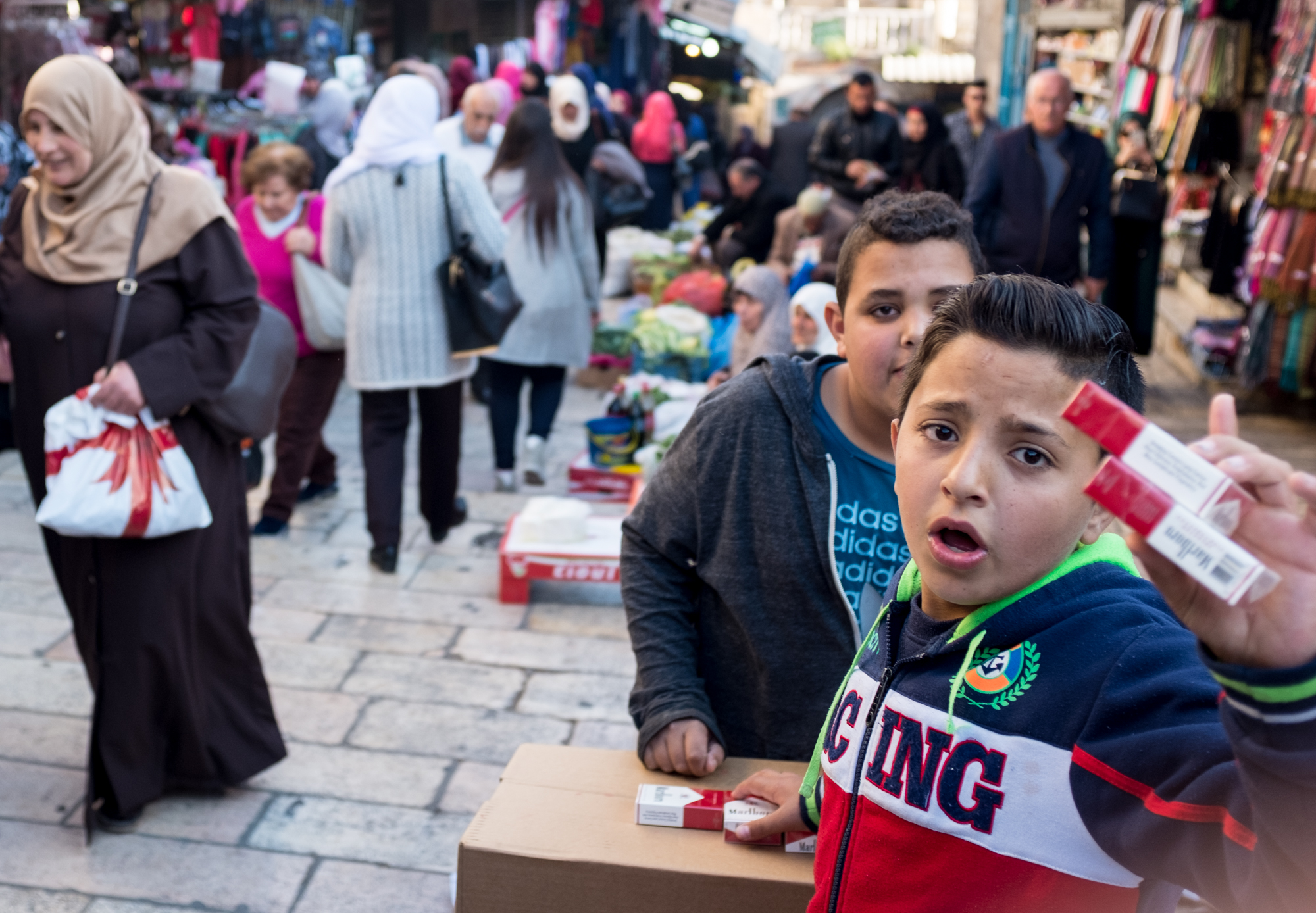 Young boys sell cigarettes in the Muslim quarter of Jerusalem's Old City.