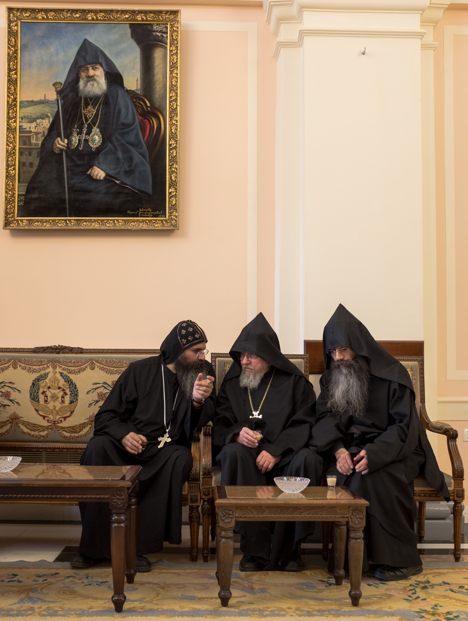 Coptic and Armenian monks talk during an Easter gathering.