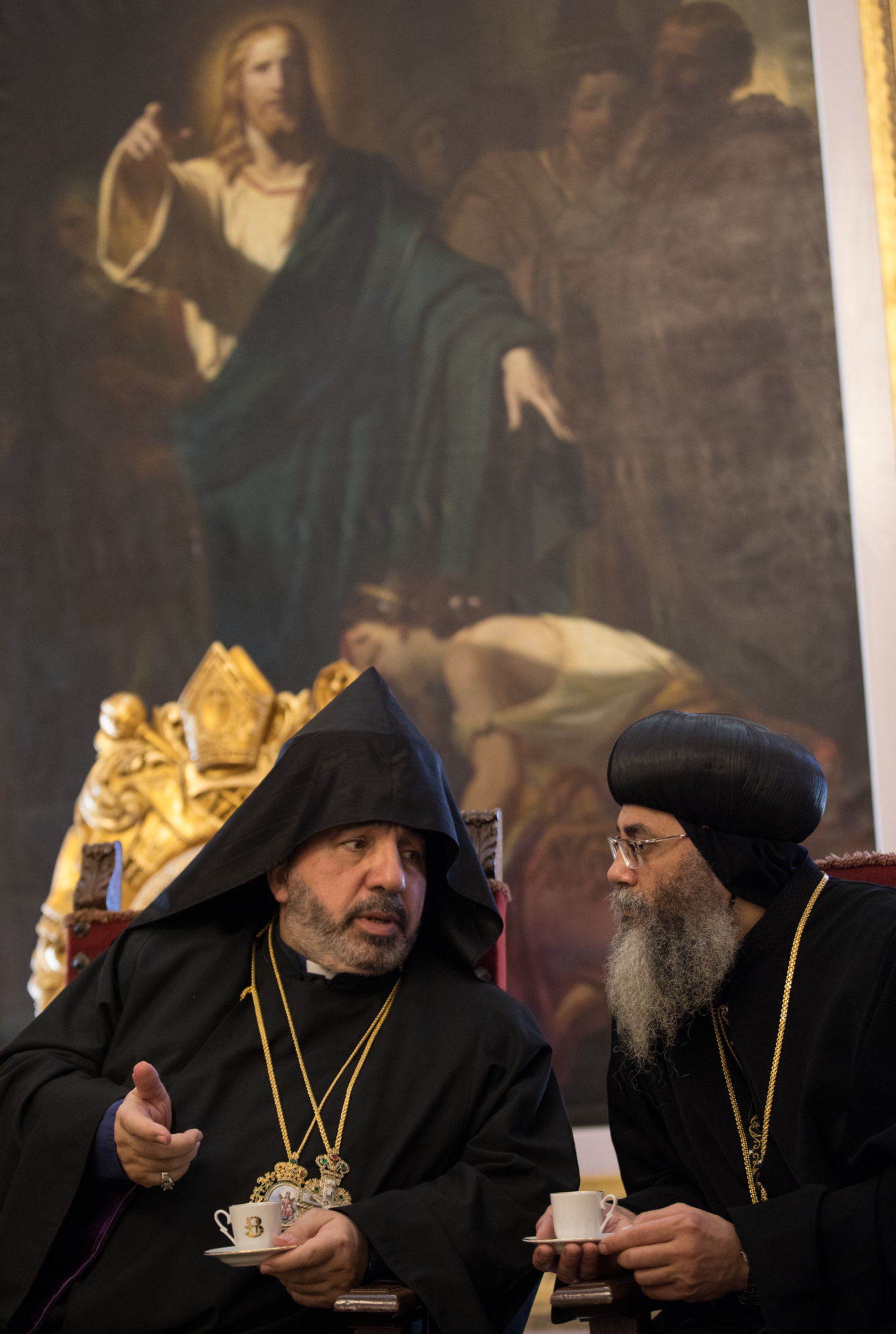 The Armenian and Coptic bishops talk during a Christmas gathering.
