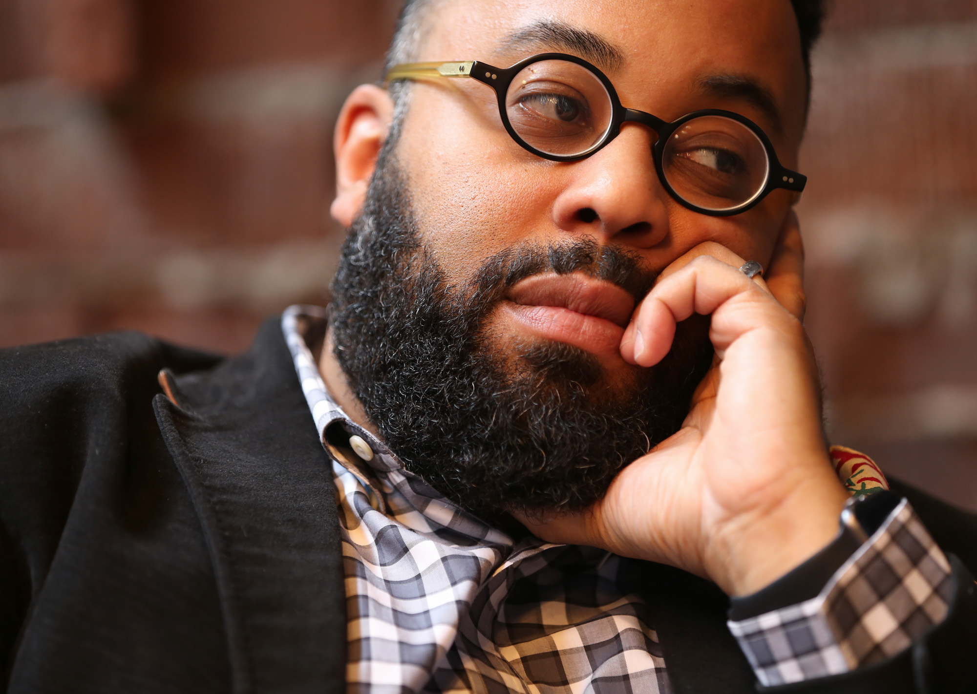 Atlanta poet and Emory professor Kevin Young, shown at Ticonderoga Club in the Krog Street Market has published nine books including "Blue Laws: Selected and Uncollected Poems, 1995-2015."