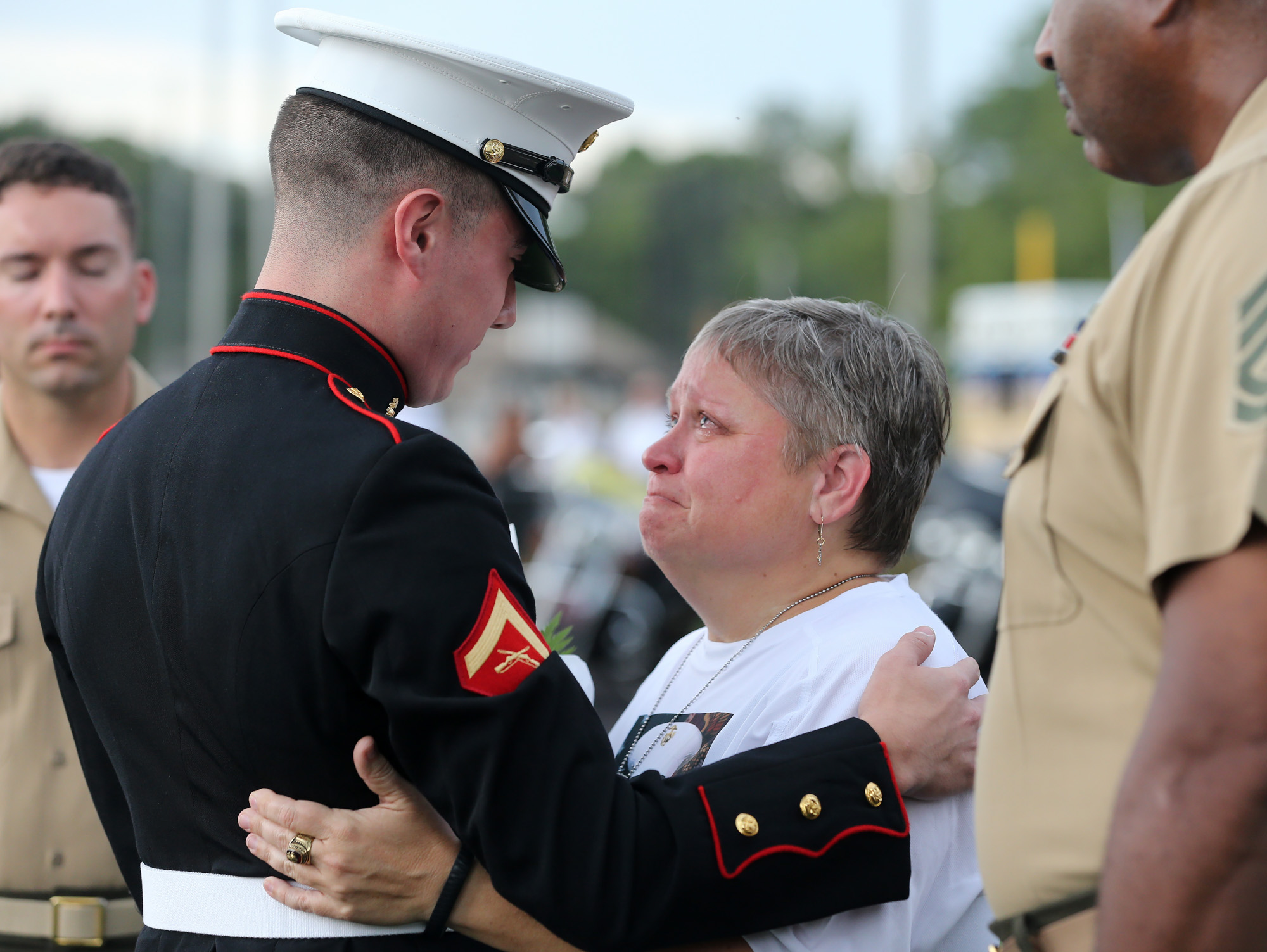 Marine Lance Corporal Kurt Bright, who was best friends with Skip Wells, greets Wells' mother Cathy Wells just after arriving at a memorial service at Sprayberry High School.