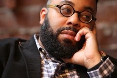 Atlanta poet and Emory professor Kevin Young, shown at Ticonderoga Club in the Krog Street Market has published nine books including "Blue Laws: Selected and Uncollected Poems, 1995-2015."