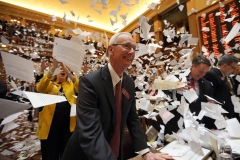House Majority Leader Larry O'Neal is all smiles as papers fly through the air just after midnight when the 2014 Legislative session comes to a close. In an annual tradition, Legislators celebrate the end of the session with their own version of confetti made from printed copies of bills and resolutions.