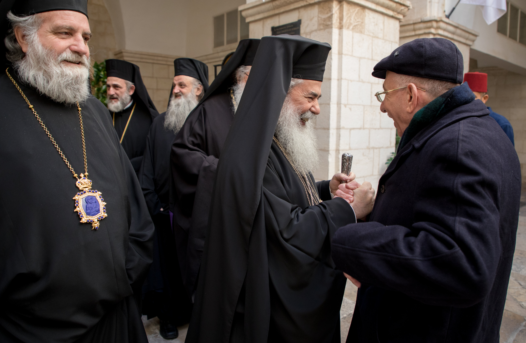 Bishop Dr. Munib Younan greets the Greek Orthodox elders during a Christmas visit.